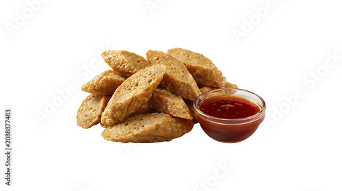 Keropok Lekor, a traditional Malaysian crispy fried fish crackers snack, served with a side of sweet chili dipping sauce, isolated on a solid uniform white background
