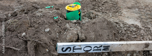 Fotografie Mineral soil, dirt, on new home build cleared lot, new broken stormwater system