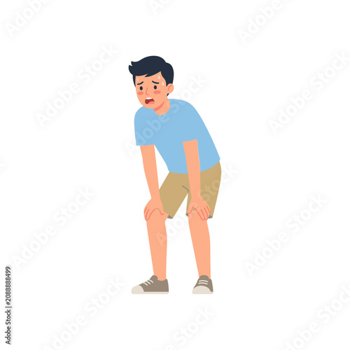 Bild auf Leinwand Exhausted Young Man Leaning Forward While Panting After Intense Physical Activit