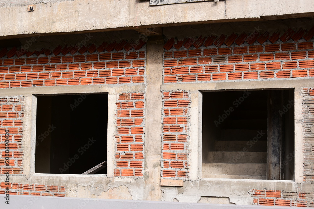 Obraz premium exterior view of brick house under construction with concrete structure