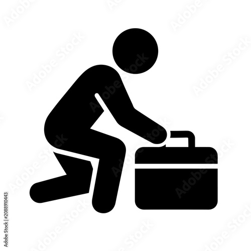 Quadro su tela Businessman figure kneels beside a briefcase to signify professional arrival or preparation for work