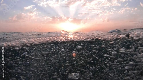 Sunbeams and bubbles underwater. Underwater slow motion bubbles moving to surface in turquoise crystal clear sea. air bubbles underwater bubbles coming up to the surface blue water ocean scenery. Pool