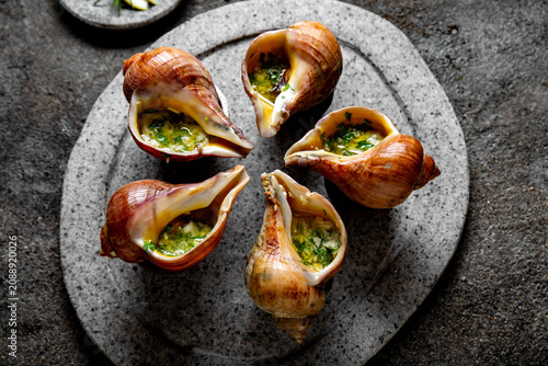 Картината върху платно Baked Giant Pacific Escargot with Garlic Butter and Herbs