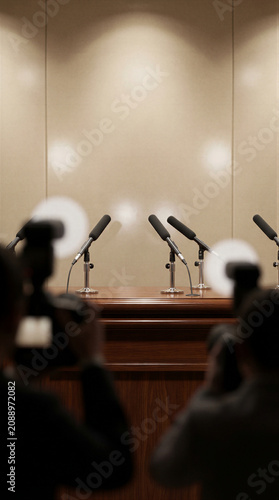 Empty press conference podium with microphones
