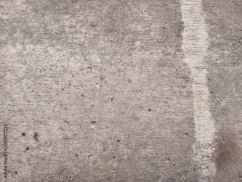 Fotografía Full frame texture of dry weathered concrete surface with fine cracks and rough