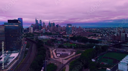 Philadelphia Skyline Aerial Drone Shot at Dusk with Moody Purple Clouds over Schuylkill River
