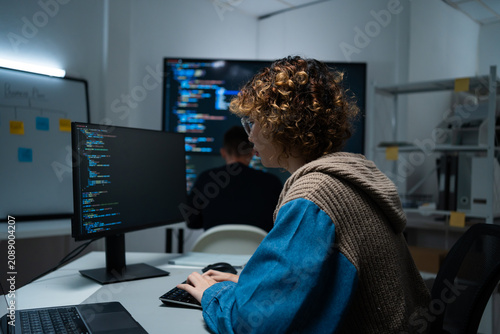software developer talk strategy plan to executive write prompt AI bot IT app program data analytics in tech startup office.Projected visuals and glowing code on screen.AI chatbot technology concept