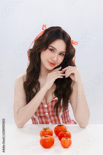 Asian Beauty Woman with Fresh Tomatoes for Healthy Skin and Skincare Nutrition Concept