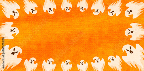 Fotografie Cute spooky little ghosts framing a vibrant orange background