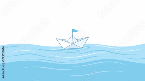 Origami boat sailing on blue water