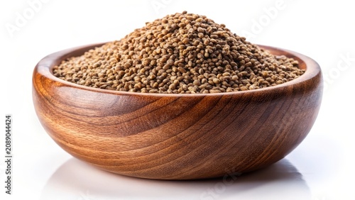 Brown organic ajwain seed in a wood bowl on a white background ajowan seed