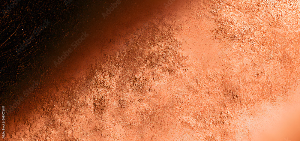 Fototapeta premium A terracotta background with a grainy texture and soft gradients, a warm copper blurred backdrop, earthy clay colored wallpaper with organic lighting and shading.