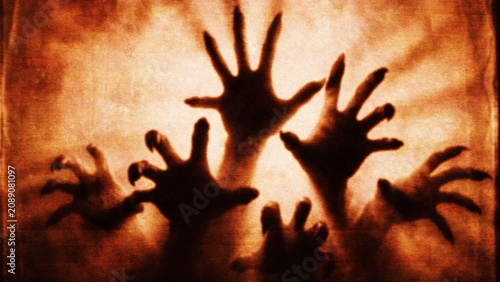 Cuadro en lienzo Spooky Halloween hands reaching through a textured ominous dimly lit surface dur
