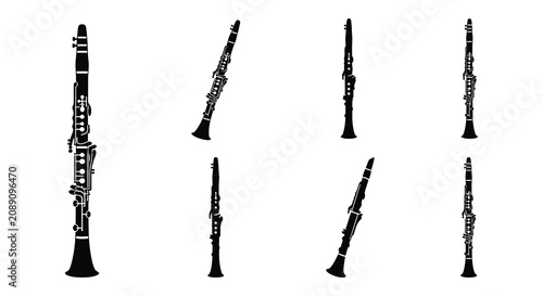 Black vector silhouettes of various woodwind instruments on a white background