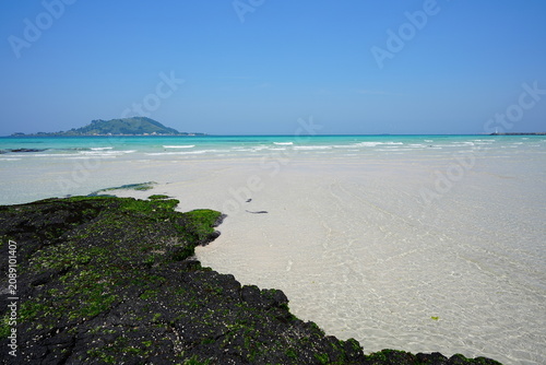 shoaling beach and clear water and island