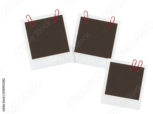 Three blank polaroid photos with red paper clips on white background transparent background