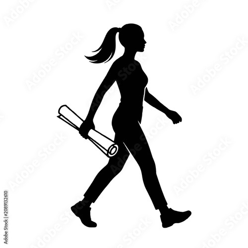 Silhouette of a female engineer walking while holding a rolled architectural blueprint