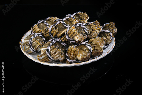 Fresh Yangcheng Lake Hairy Crabs from Suzhou China on White Plate Black Background Premium Seafood Delicacy