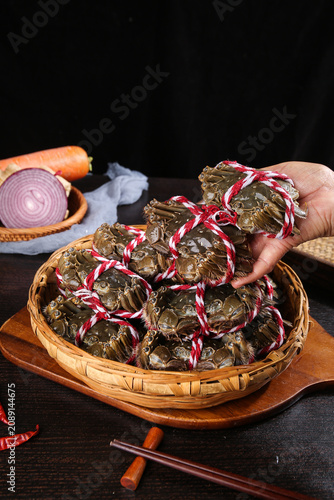 Fresh Yangcheng Lake Hairy Crabs from Suzhou China in Traditional Bamboo Basket with Red Ribbons