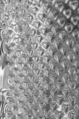 Obraz na plátně Embossed silvery metallic textured pattern reflecting bright ambient light backg