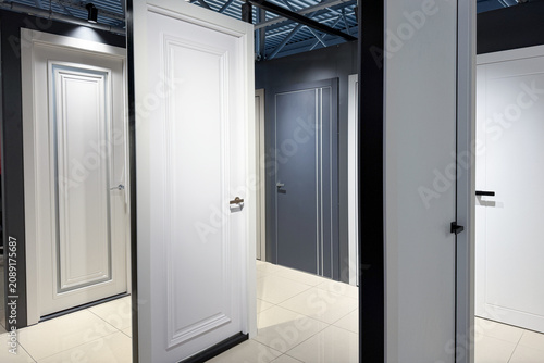 Contemporary white and grey panel interior doors displayed for sale indoors