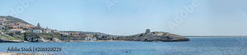 Konstfotografi Su Putu tower on rocky cape and village on cove shore, s