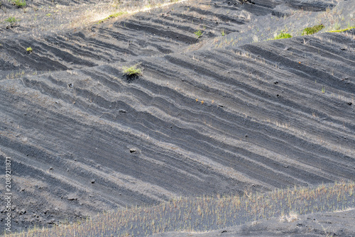 Fotografie Black volcanic scoria slopes on Croscat volcano in Catalonia, Spain