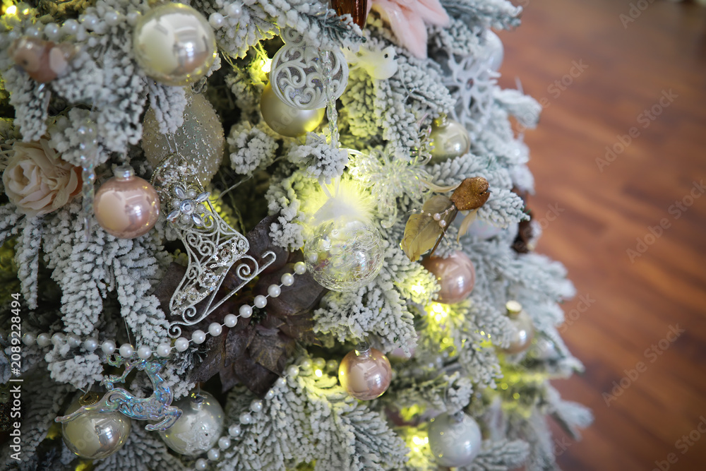 Fototapeta premium Festive Christmas Tree with Ornaments and Lights; Shiny Holiday Decorations; Seasonal Home Decor