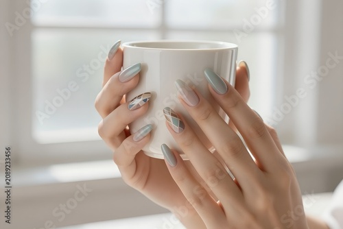 Stylish Pastel Geometric Nail Art Extensions on Elegant Hands