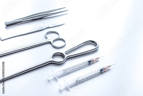 instruments for plastic surgery on white background