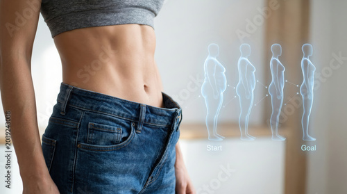 Slim woman shows weight loss progress with reduced waistline and improved BMI, highlighting journey from obesity to healthier body goal in motivating visual