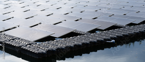 Bild auf Leinwand Solar cells in solar farms on surface mounting management on water, alternative