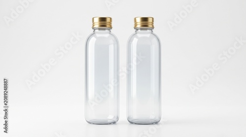 Glass bottles with gold caps on white background in clean studio lighting for product mockup.