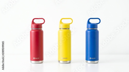 Water bottles, vibrant and clean, with bright studio lighting on a white background for product display.