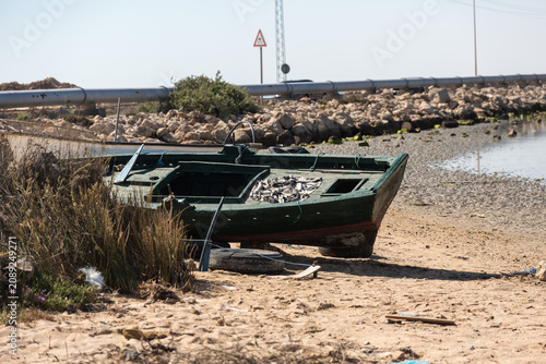Old boat on the shore of Djerba