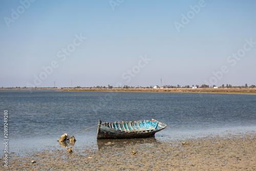 Old boat on the shore of Djerba