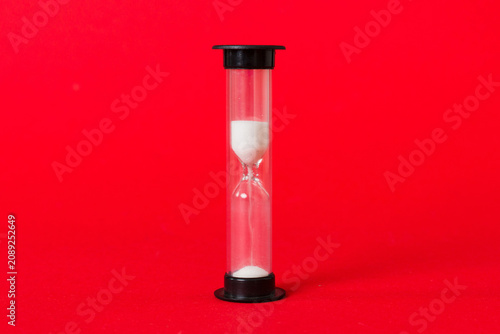 hourglass on the table, sand clock as time passing concept for business deadline, copy space