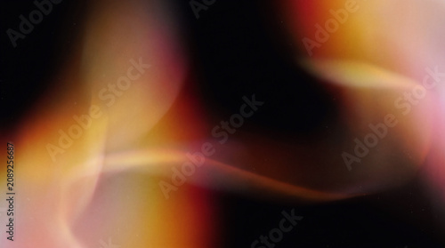 Abstract retro gradient light leak effect with soft blurred luminous overlays flowing across a pure black background.