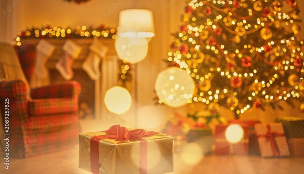 Fototapeta premium Warm and cozy Christmas living room interior with glowing tree and gift boxes.