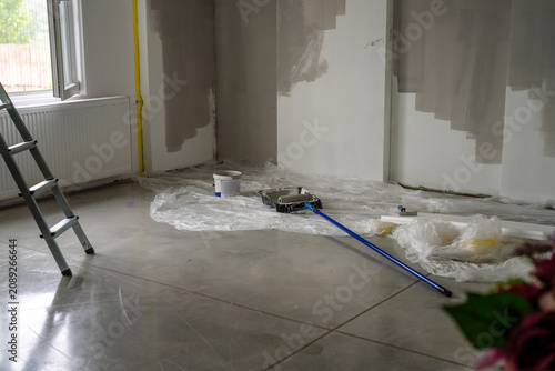 Принти на полотні Room renovation painting walls with roller and ladder