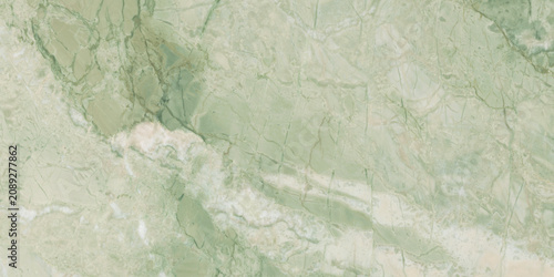 Elegant green marble texture with soft natural veins and warm earthy tones, perfect for luxury interiors, ceramic tiles, and decorative backgrounds.
