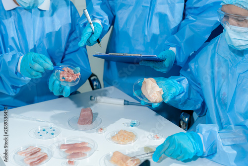 Foto Lab work, Doctor holds a test tube takes the test from a test tube in analysis, chemical residues food
