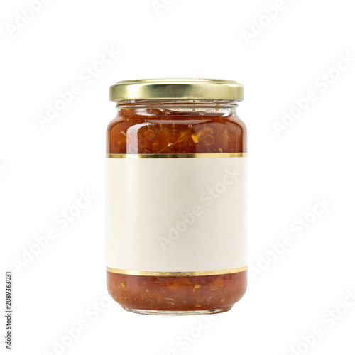 A glass jar filled with chunky orange fruit marmalade or preserve, featuring a gold metal lid and a blank white paper label on a white background