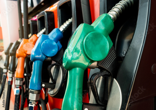 Fotografie Petrol pump filling fuel nozzle in gas station