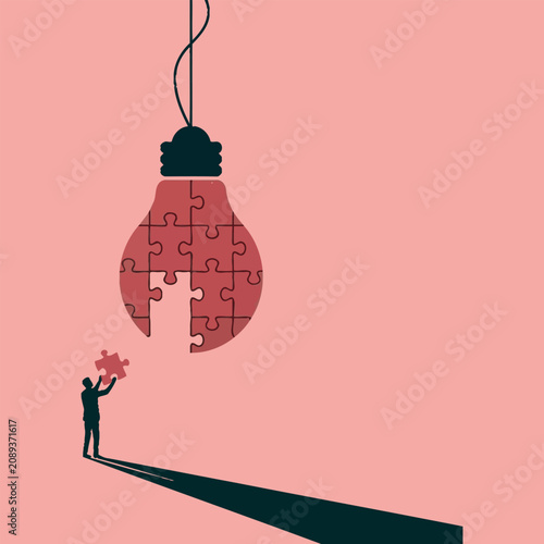 Businessman Completing Red Lightbulb Puzzle Piece For Final Inspiration
