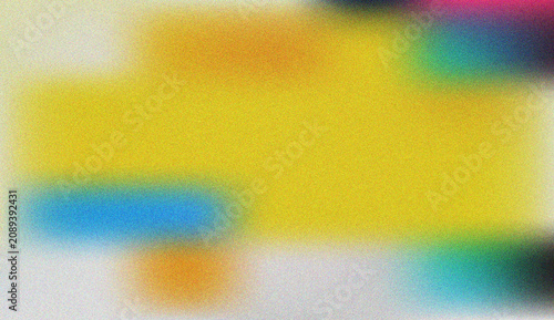 Vibrant abstract blur of colorful grains with a dominant yellow and playful spectrum of hues