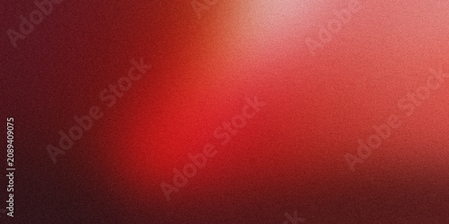 Fotografie Abstract grainy background with glowing red light effect illuminating dark textu
