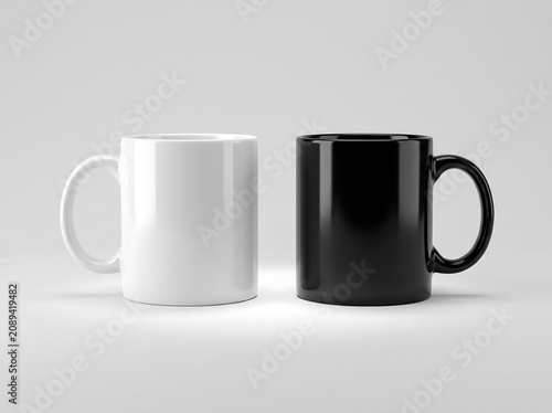 Two ceramic coffee mugs in solid white and black colors placed side by side on a neutral surface with beverage