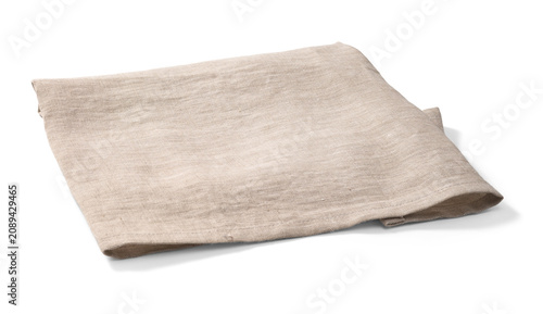 Natural beige linen towel casually folded on a white background. Kitchen napkin isolated.