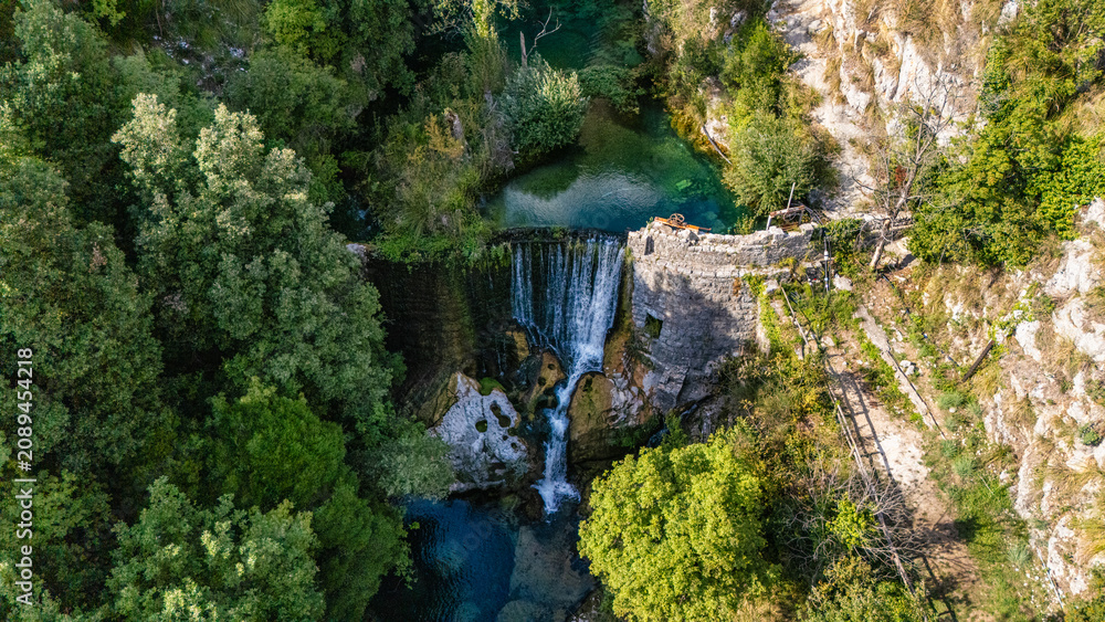 Naklejka premium Waterfall on the Auso river, Cilento, Campania, Italy.